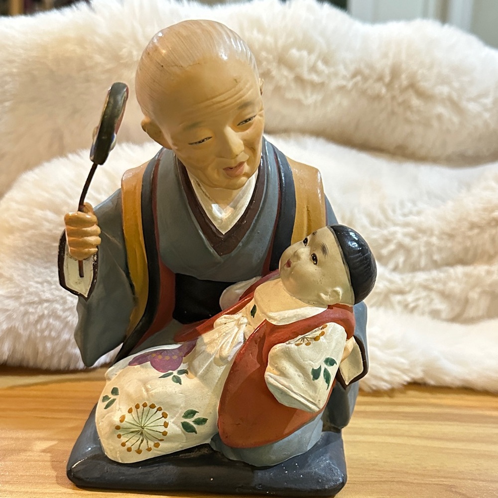 Made in Japan Hand-Painted Ceramic Figurine with Red and Blue Accents.